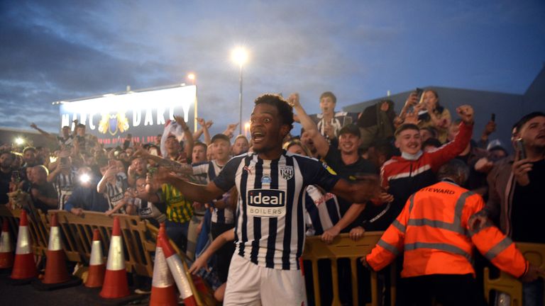 West Brom players celebrated with fans after their promotion