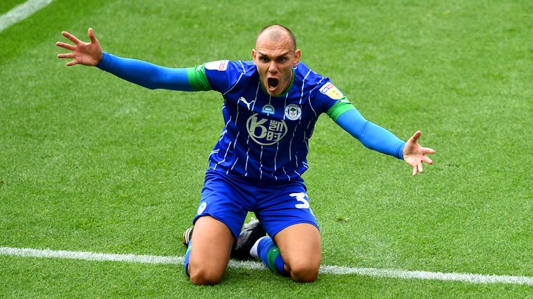 Kal Naismith celebrates putting Wigan 1-0 up in the first minute