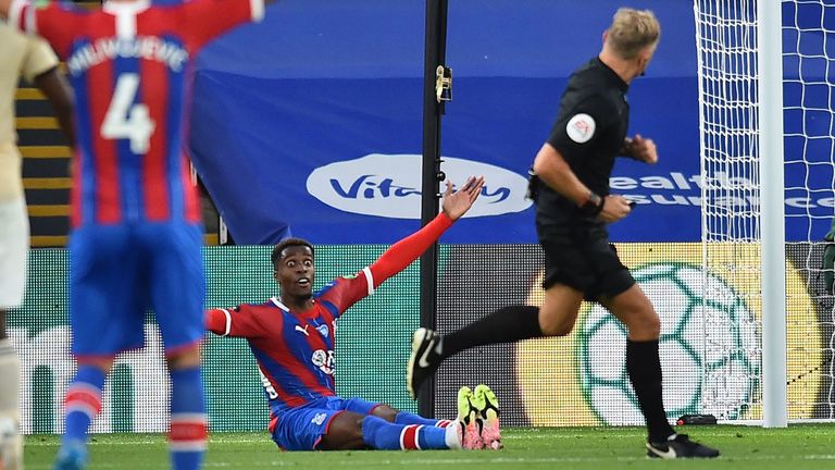 Wilfried Zaha is incensed after Graham Scott fails to award a penalty