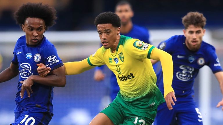 Willian and Jamal Lewis battle for possession during Chelsea vs Norwich