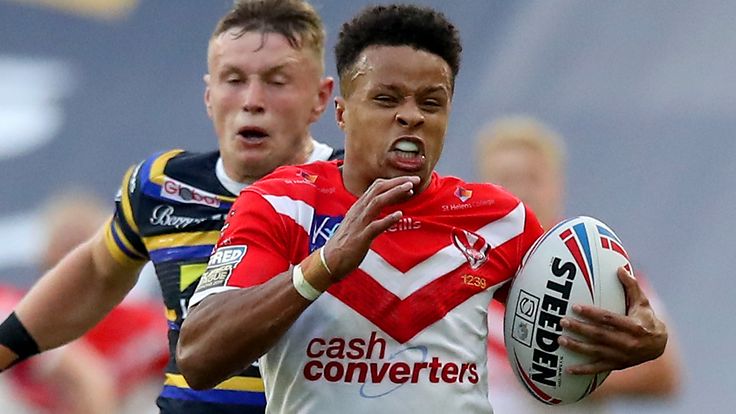 Regan Grace sprints away from Leeds Rhinos' Harry Newman to complete his hat-trick