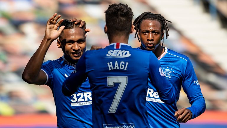 Alfredo Morelos celebrates after his shot was turned into the net by Conor McCarthy