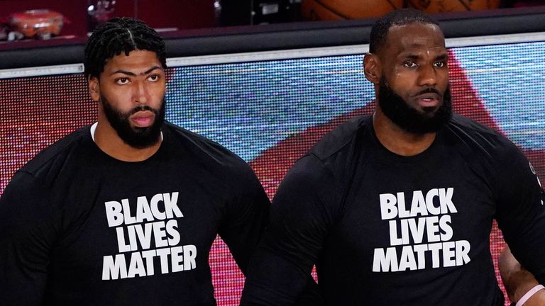 Anthony Davis and LeBron James kneel during the national anthem in support of Black Lives Matter