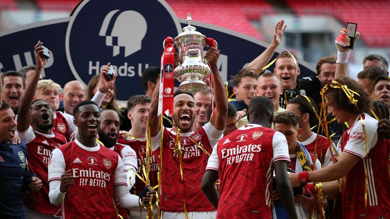 Pierre-Emerick Aubameyang lifts the FA Cup after his doubled inspired Arsenal to a 2-1 victory over Chelsea at Wembley