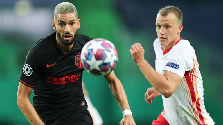 Atletico Madrid's Yannick Carrasco vies with RB Leipzig's  Lukas Klostermann