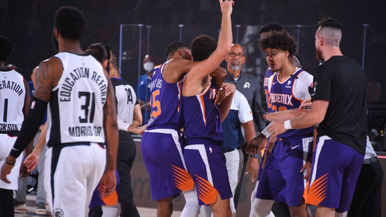 Relive Devin Booker&#39;s epic game-winning buzzer beater as the Phoenix Suns upset the Los Angeles Clippers.
