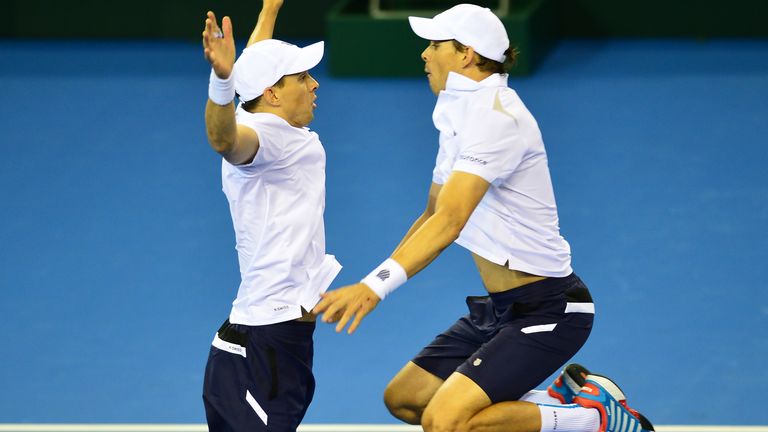 Bob Bryan (L), and Mike Bryan of the United States celebrate their win in five sets against Dominic Inglot and Jamie Murray of the Aegon GB Davis Cup Team during the doubles match on Day 2 of the Davis Cup match between GB and USA at the Emirates Arena on March 7, 2015 in Glasgow Scotland.