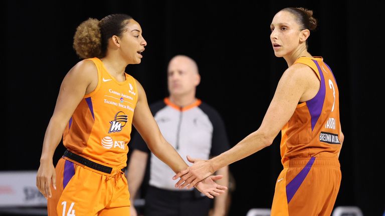 Bria Hartley (L) low-fives Phoenix Mercury team-mate Diana Taurasi