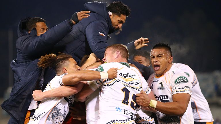 The Brumbies celebrate their last-gasp victory over the Reds