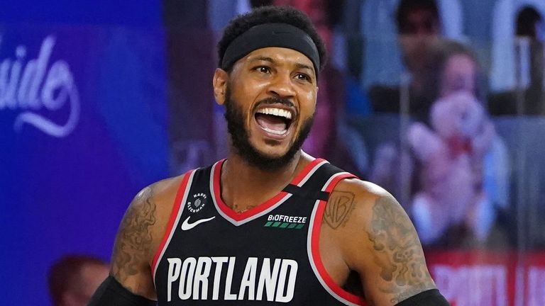 Carmelo Anthony celebrates the Trail Blazers' victory in the Western Conference Play-In