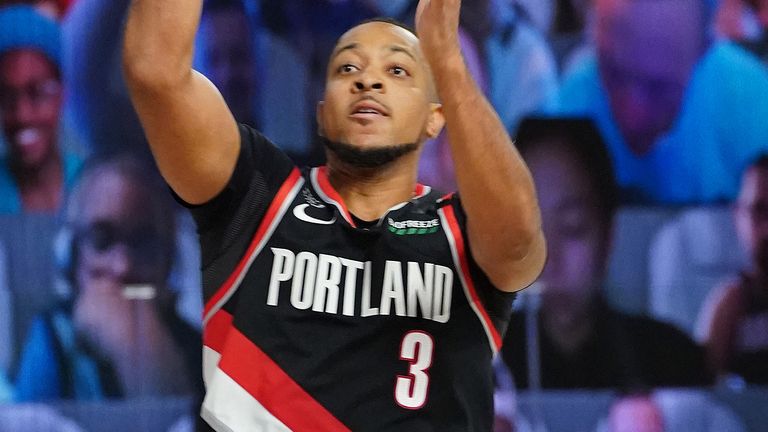 CJ McCollum lofts a shot to score in Portland&#39;s Western Conference Play-In win over the Memphis Grizzlies