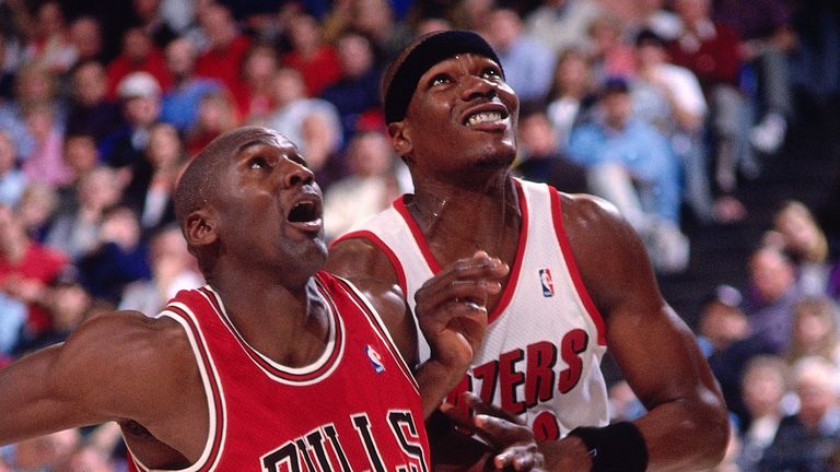 Clifford Robinson battles for position with Chicago Bulls great Michael Jordan during a game in 1993