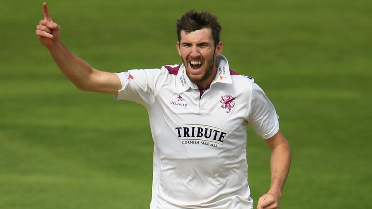 Craig Overton of Somerset celebrates after taking the wicket of Josh Shaw
