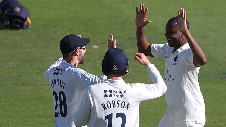 Middlesex's Miguel Cummins celebrates a wicket with team-mates Stephen Eskinazi and Sam Robson