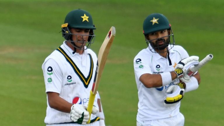 Mohammad Rizwan (R) and Naseem Shah leave the field after bad light ends play on day two of the second Test between England and Pakistan