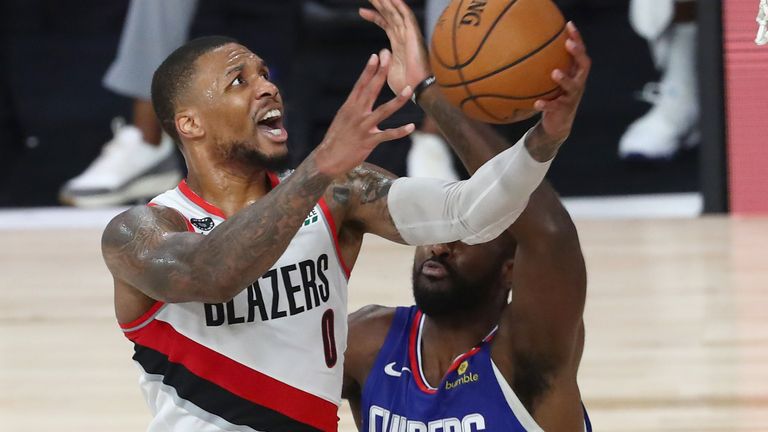 Damian Lillard attacks the basket against the Clippers