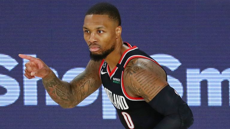 Damian Lillard acknowledges an assist during Portland's win over Dallas