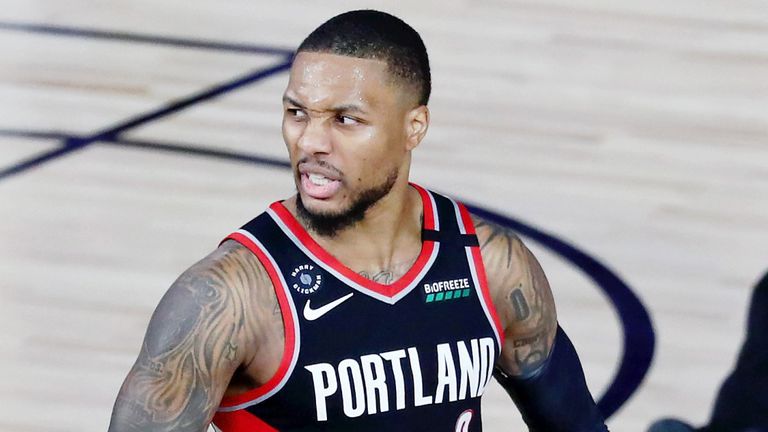 Damian Lillard celebrates after scoring a career-high-equalling 61 points against the Dallas Mavericks