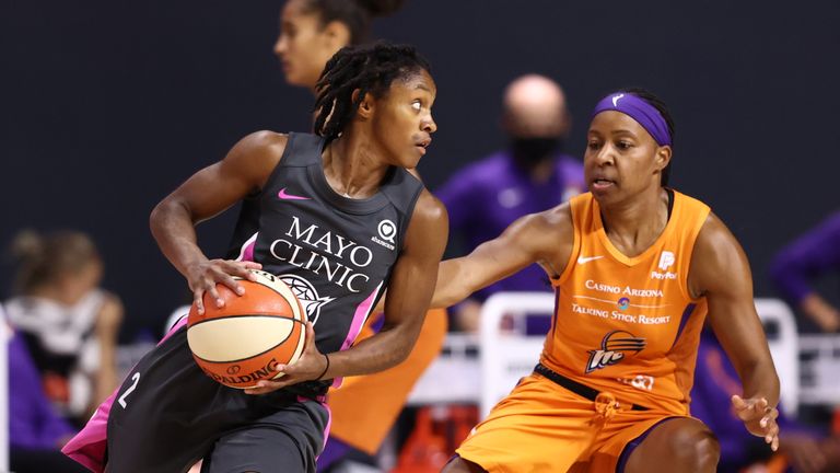 Crystal Dangerfield of the Minnesota Lynx handles the ball during the game against the Phoenix Mercury