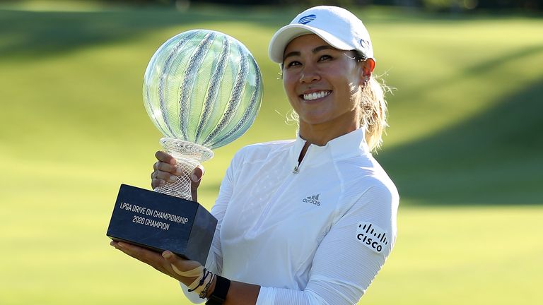 Danielle Kang poses with the trophy after winning the LPGA Drive On Championship