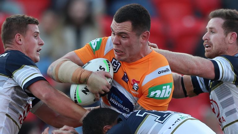 NEWCASTLE, AUSTRALIA - AUGUST 23: David Klemmer of the Newcastle Knights is tackled during the round 15 NRL match between the Newcastle Knights and the North Queensland Cowboys at McDonald Jones Stadium on August 23, 2020 in Newcastle, Australia. (Photo by Ashley Feder/Getty Images)