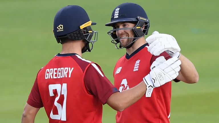 Dawid Malan celebrates with Lewis Gregory after hitting the winning runs for England in the second T20I