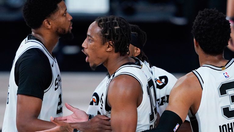 DeMar DeRozan celebrates with his Spurs team-mates