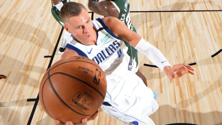 Kristaps Porzingis scores at the rim against the Milwaukee Bucks