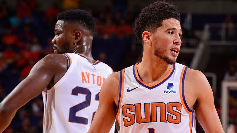 DeAndre Ayton and Devin Booker in action for the Phoenix Suns