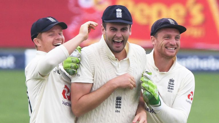 SOUTHAMPTON, ENGLAND - AUGUST 14: Dominic Sibley of England(C) celebrates with Ollie Pope(L) and Jos Buttler of England(R) after running out Shaheen Afridi of Pakistan during Day Two of the 2nd #RaiseTheBat Test Match between England and Pakistan at the Ageas Bowl on August 14, 2020 