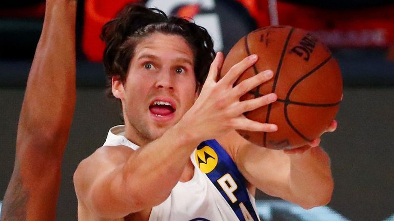 Doug McDermott attacks the basket against the Miami Heat
