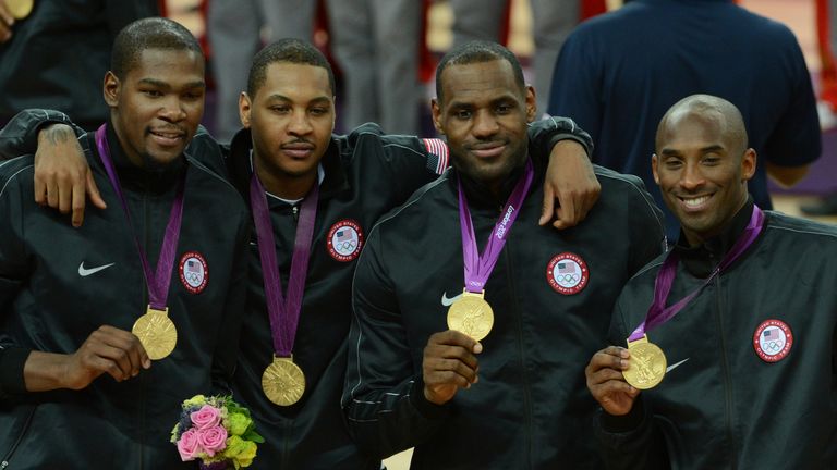 Kevin Durant, Carmelo Anthony, LeBron James and Kobe Bryant of the US Men&#39;s Senior National Team poses for a photo with the Gold Medal