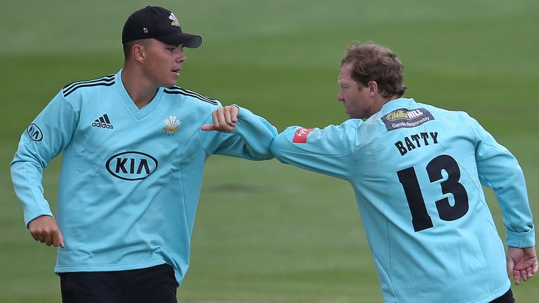 Gareth Batty of Surrey celebrates taking the wicket of Ravi Bopara of Sussex Shark with James Taylor (L) during the Vitality T20 Blast match between Sussex Sharks and Surrey at The 1st Central County Ground on August 28, 2020 in Hove, England. 