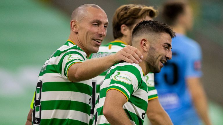 Celtic's Greg Taylor celebrates his goal with team-mate Scott Brown against KR Reykjavik