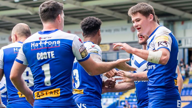 Picture by Allan McKenzie/SWpix.com - 30/08/2020 - Rugby League - Betfred Super League - Hull KR v St Helens - Halliwell Jones Stadium, Warrington, England - St Helens&#39;s Jack Welsby  is congratulated by team mates on scoring a try against Hull KR.