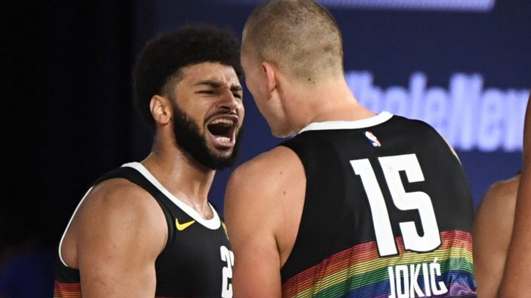 Jamal Murray celebrates with Denver Nuggets team-mate Nikola Jokic