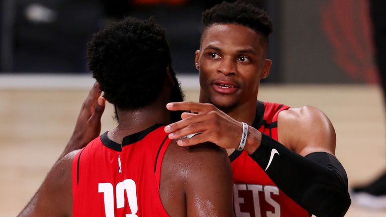 James Harden embraces team-mate Russell Westbrook during the Rockets' opening restart win