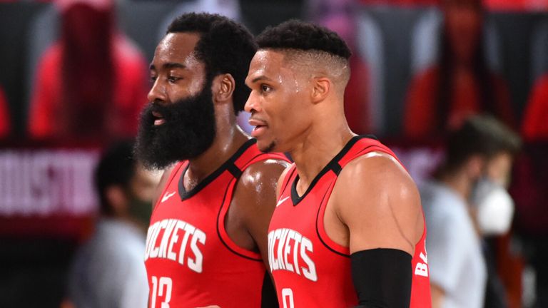 James Harden and Russell Westbrook walk off the court together 