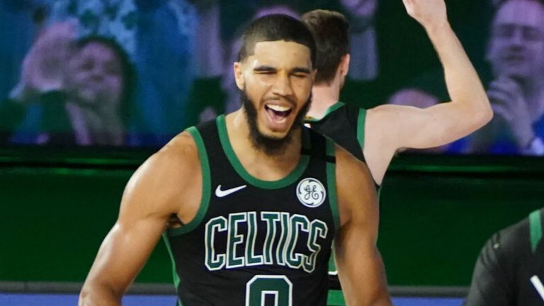 Jayson Tatum celebrates following the Celtics' Game 1 win over the 76ers