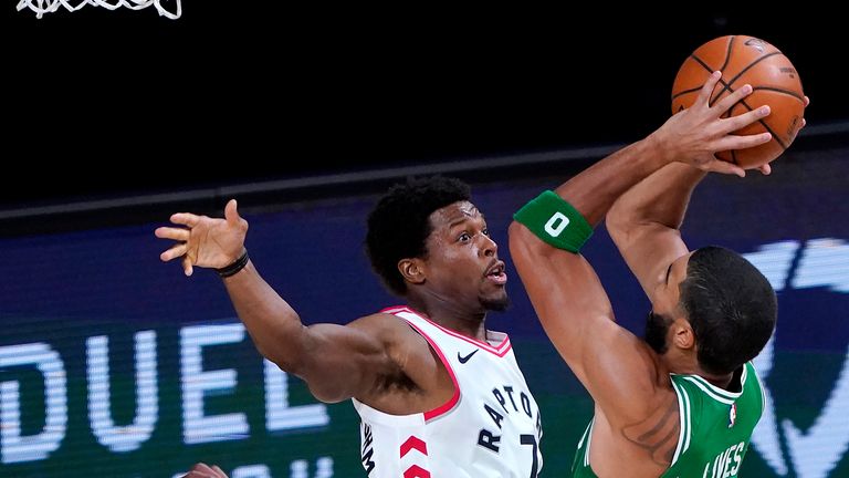 Boston Celtics&#39; Jayson Tatum goes up for a shot against Toronto Raptors&#39; Kyle Lowry