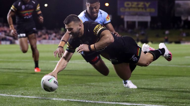 SYDNEY, AUSTRALIA - AUGUST 21: Josh Mansour of the Panthers dives over to score a try during the round 15 NRL match between the Penrith Panthers and the Cronulla Sharks at Panthers Stadium on August 21, 2020 in Sydney, Australia. (Photo by Mark Kolbe/Getty Images)