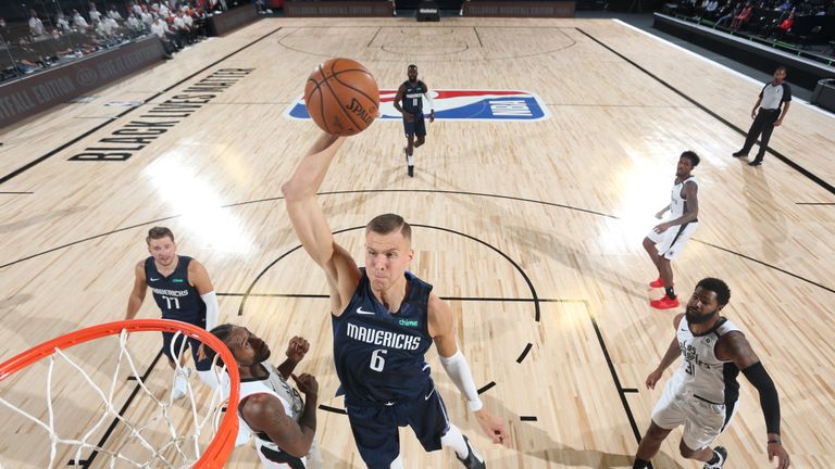 Kristaps Porzingis #6 of the Dallas Mavericks dunks the ball against the LA Clippers on August 6, 2020 at the HP Field House at ESPN Wide World of Sports in Orlando, Florida. 