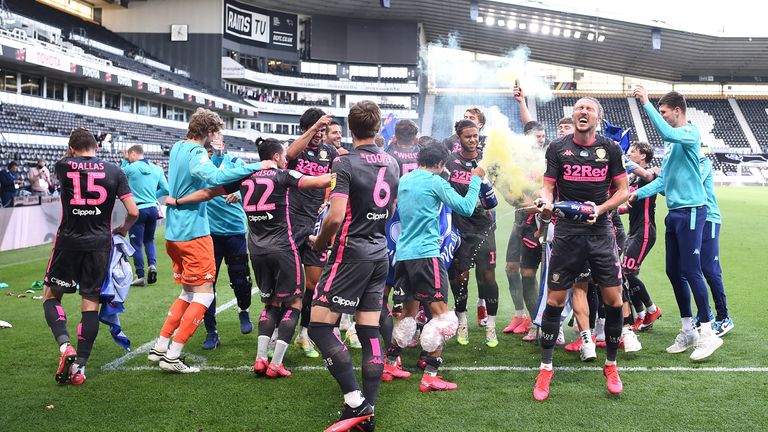 Leeds players celebrate their promotion to the Premier League after a 3-1 win at Pride Park in July