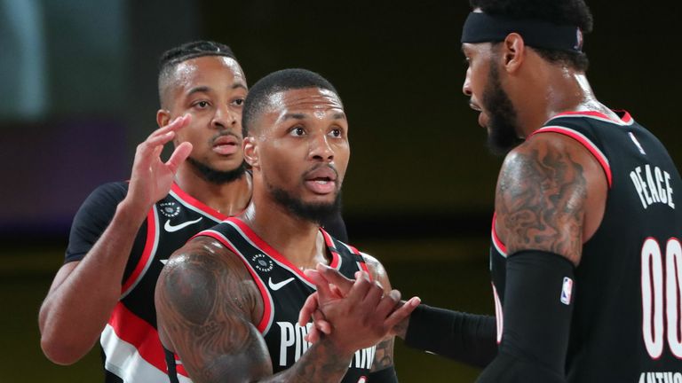 Damian Lillard celebrates with his portland Trail Blazers&#39; teammates