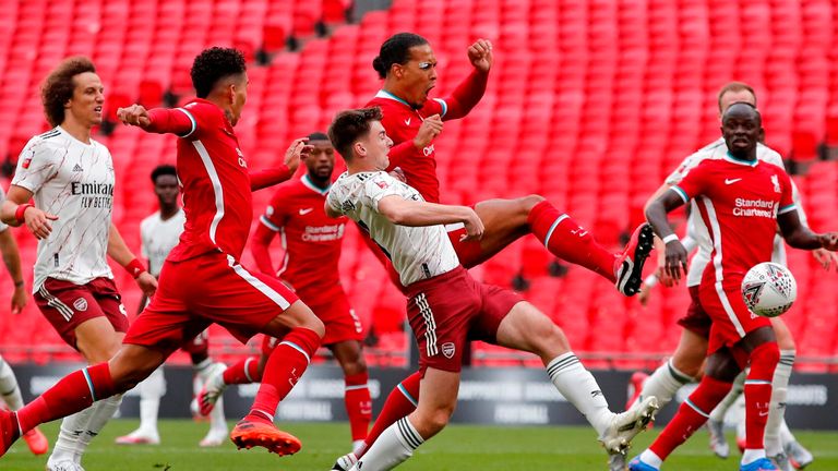 Liverpool's Virgil van Dijk kicks the ball to score a goal which was disallowed in the Community Shield against Arsenal