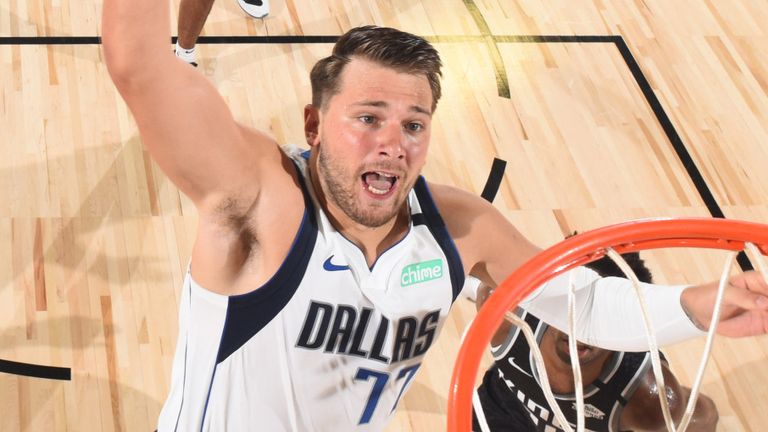 Luka Doncic rises to the rim to score en route to a triple-double against the Sacramento Kings