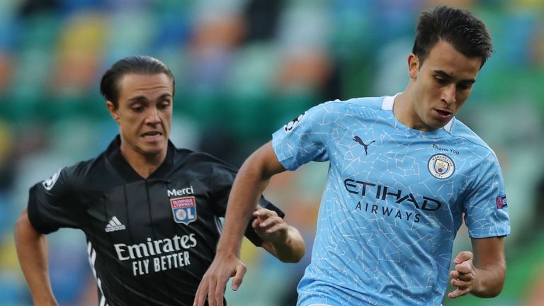 Lyon's French midfielder Maxence Caqueret (L) vies with Manchester City's Spanish defender Eric Garcia