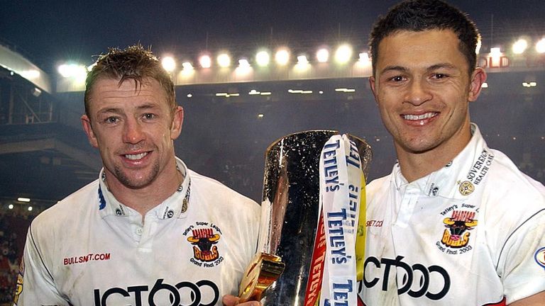 Super League Grand Final
Bradford's Mike Forshaw (left) and son join Robbie Paul as they parade the Super League Trophy around Old Trafford after beating Wigan 25-12, during their Super League Grand Final at Old Trafford, Manchester.