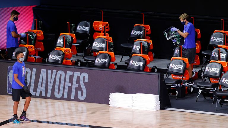 Milwaukee Bucks sideline jerseys are removed from the bench following their decision to boycott Game 5