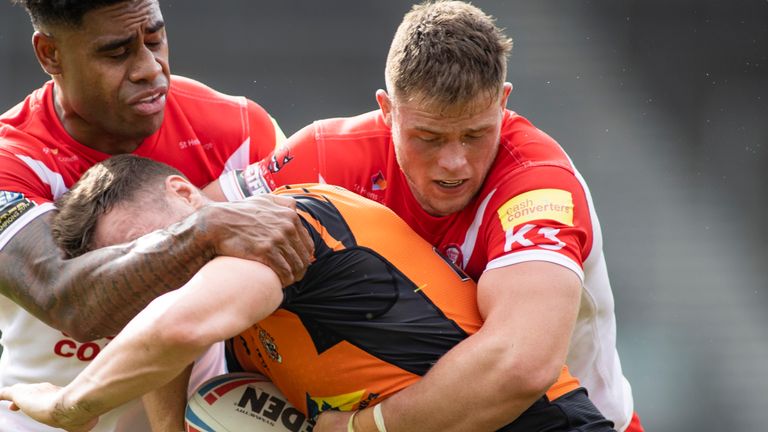 Picture by Isabel Pearce/SWpix.com - 16/08/2020 - Rugby League - Betfred Super League - St Helens v Castleford Tigers - The Totally Wicked Stadium, Langtree Park, St Helens, England - James Clare of Castleford is tackled by Morgan Knowles and Kevin Naiqama of St Helens.